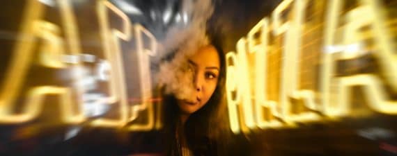 woman near yellow neon sign